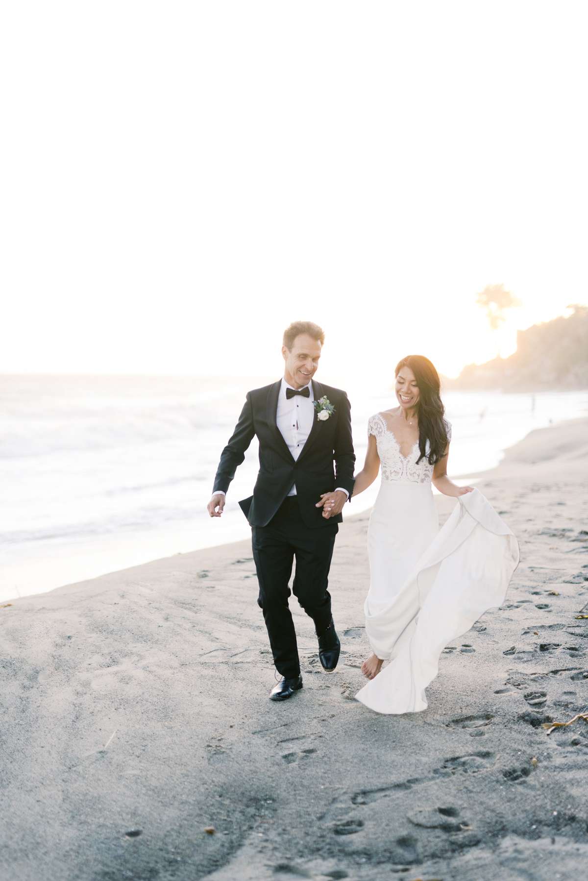 bettina gino wedding couple walking on beach