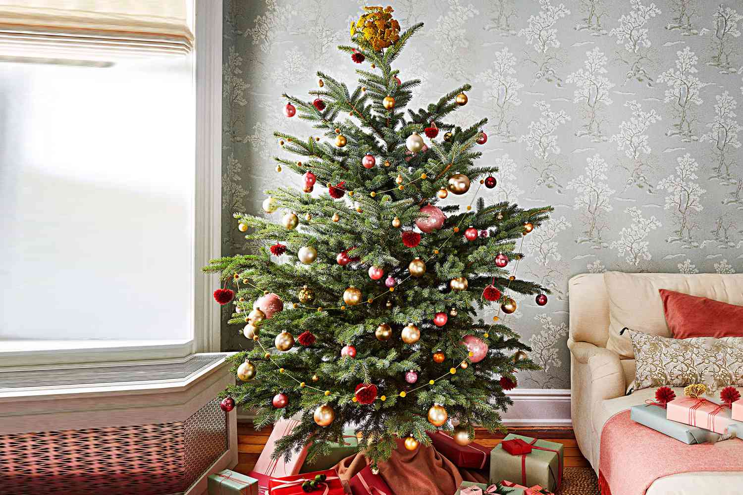 christmas tree surrounded by gifts and holiday decorations