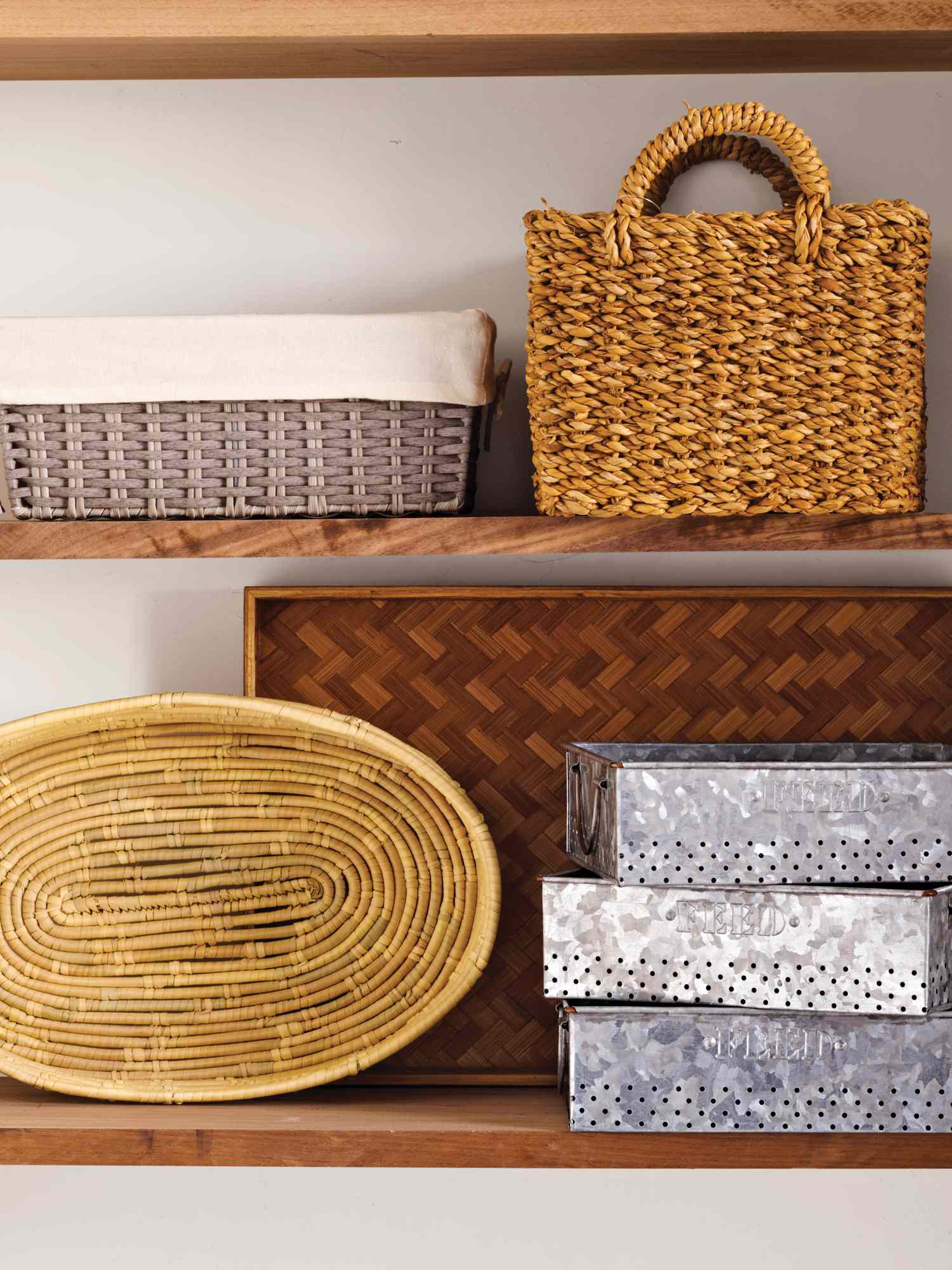 Assorted baskets and boxes arranged on wooden shelves