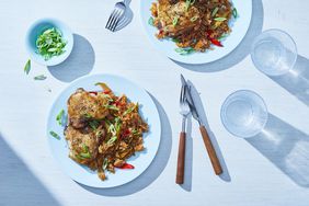 plated instant pot chicken and rice topped with green onion