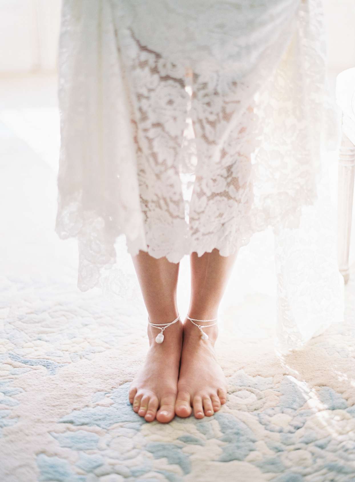 Bride wearing dress with anklets