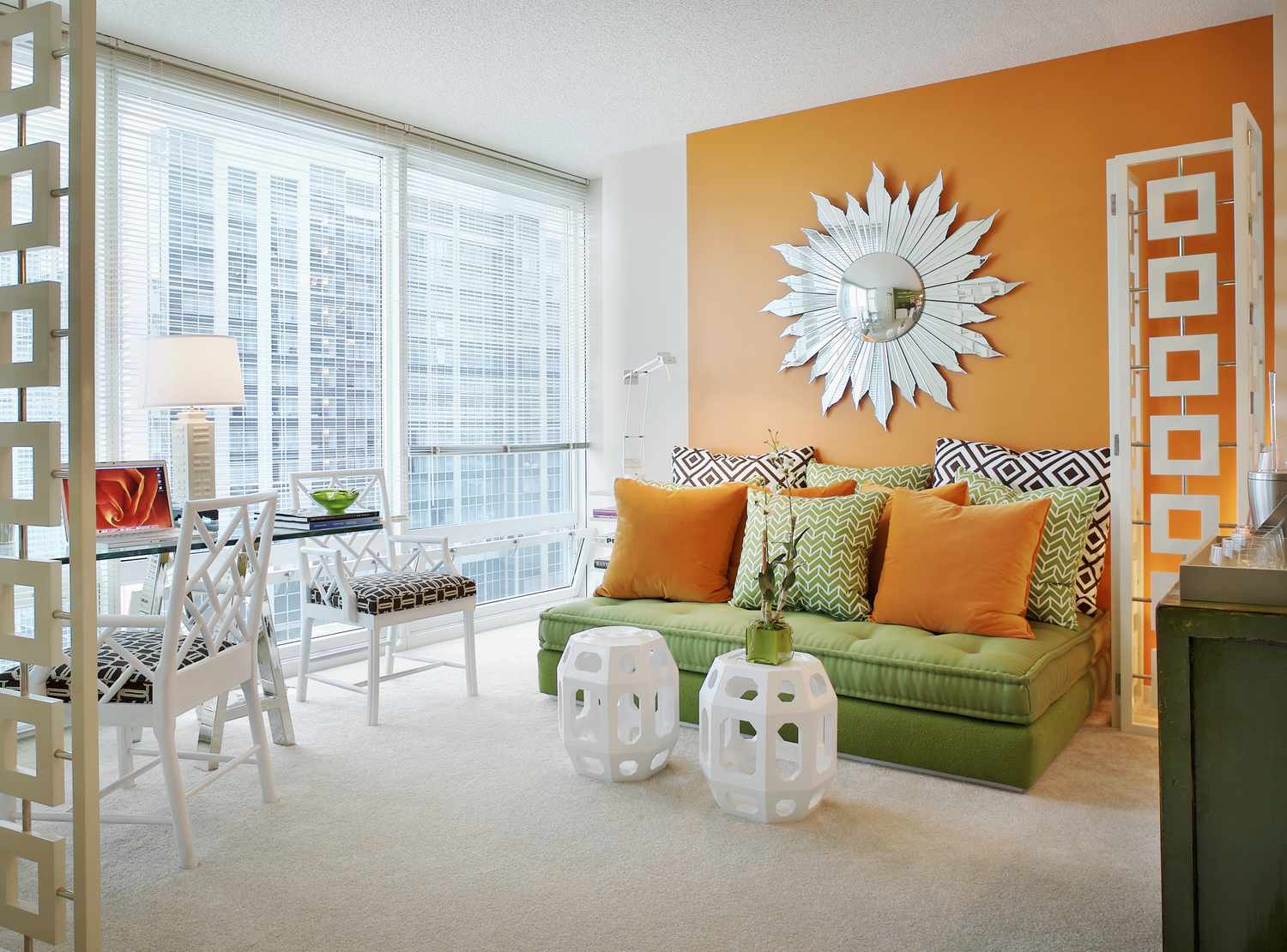 An orange living room with a green sofa