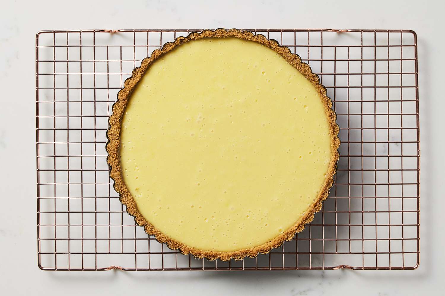Key lime tart cooling on rack