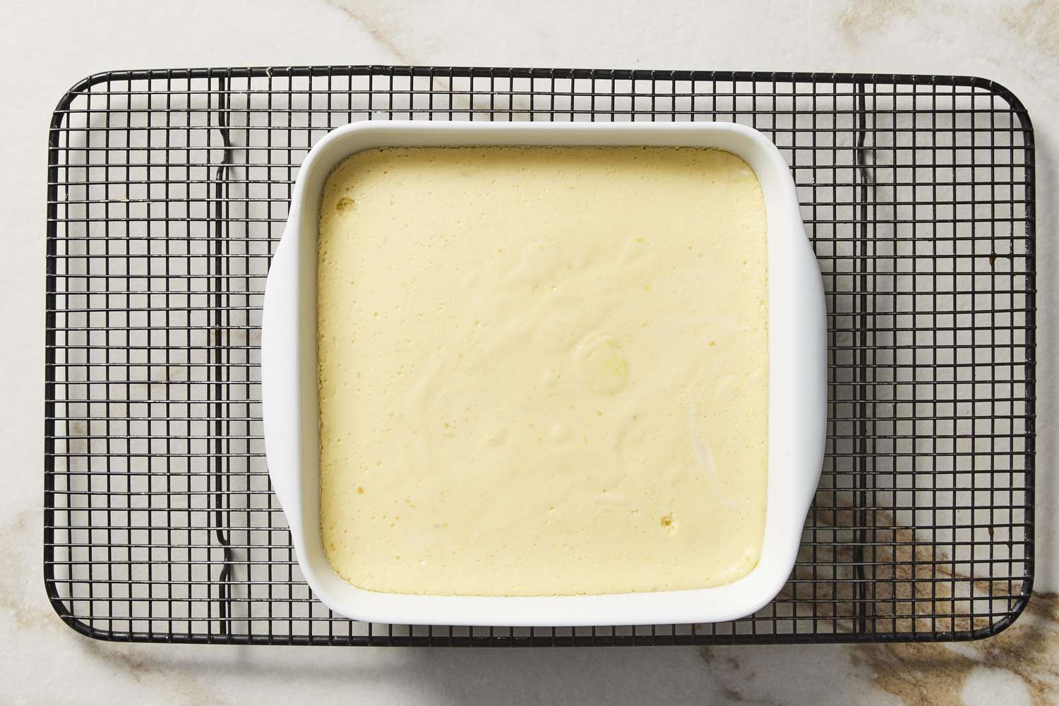 Key lime bars cooling on wire rack