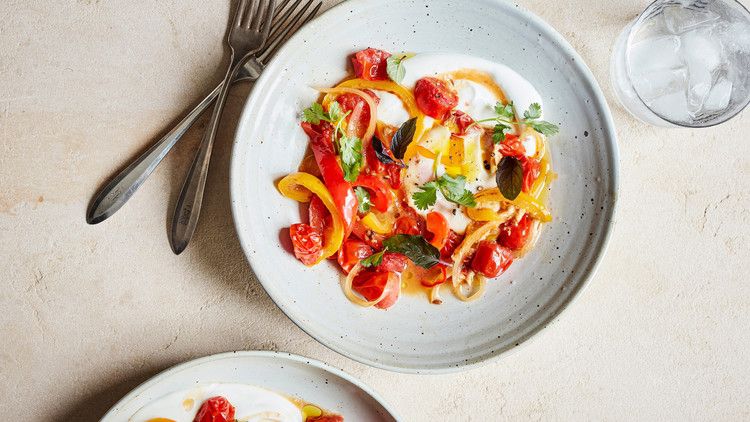spicy braised peppers and eggs served with fresh herbs