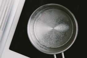 Top view of a pan with water on a modern stovetop
