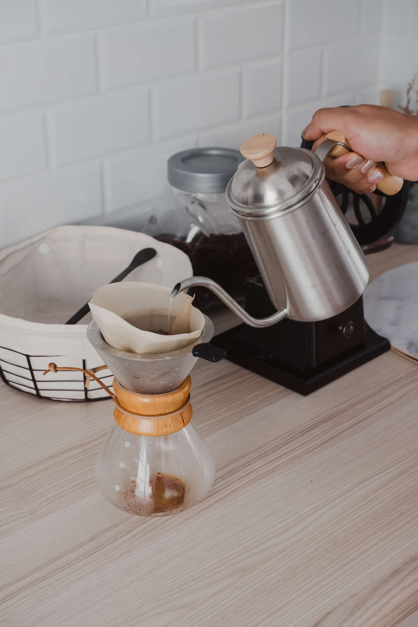 pouring hot water into coffee carafe