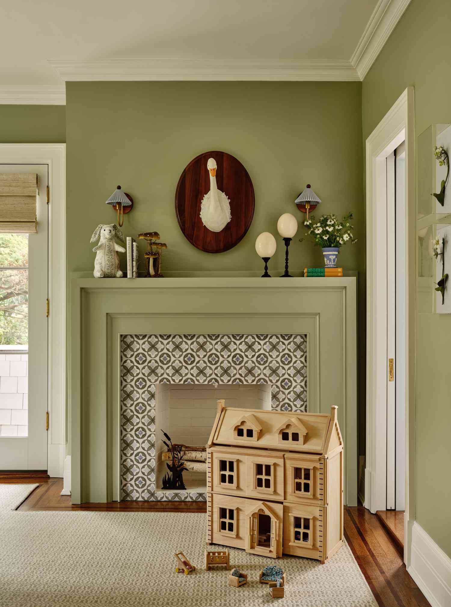 green walls and fireplace in kid's room