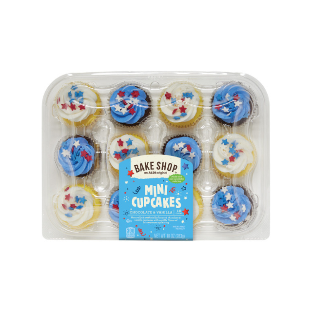 A pack of mini cupcakes with patriotic decorations in a clear plastic container