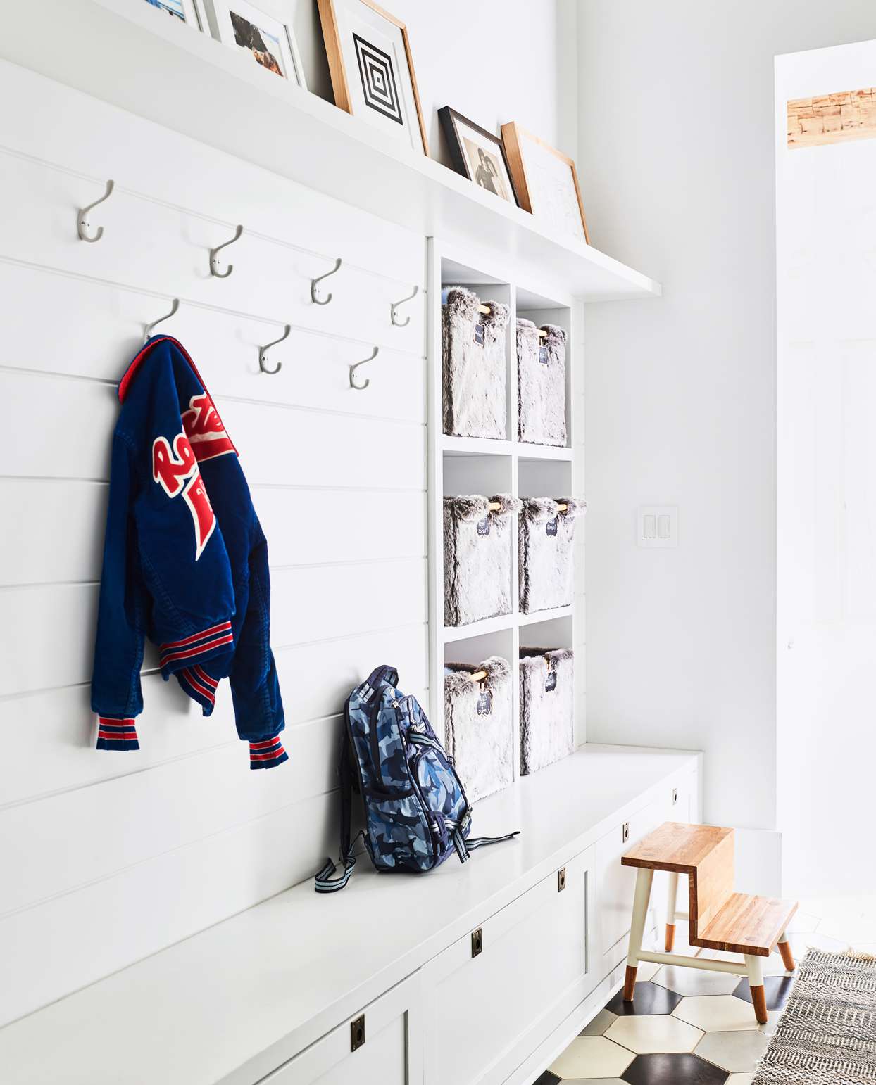 mudroom with children's belongings