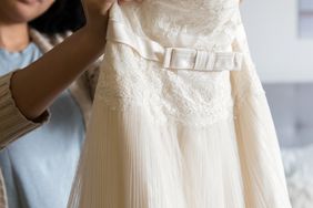 woman holding lacy dress