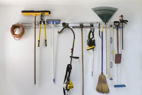 garage tools hanging on a storage rack