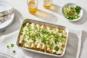 enchiladas suizas topped with jalapenos and cilantro