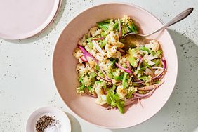 cauliflower faux-tato salad served in a pink bowl