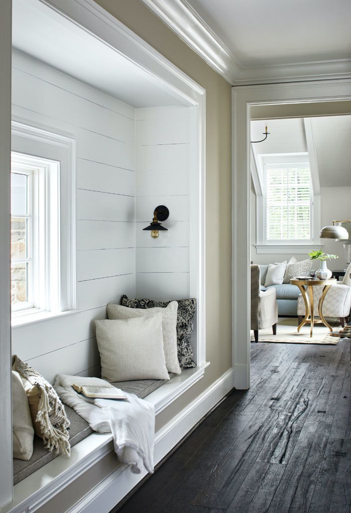 white hallway with bench seating