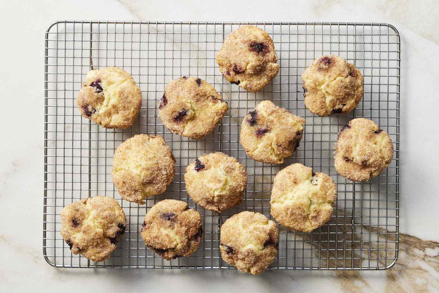 Blueberry muffins cooling on rack