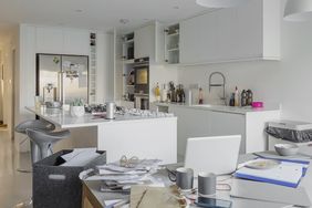 kitchen with piles of clutter