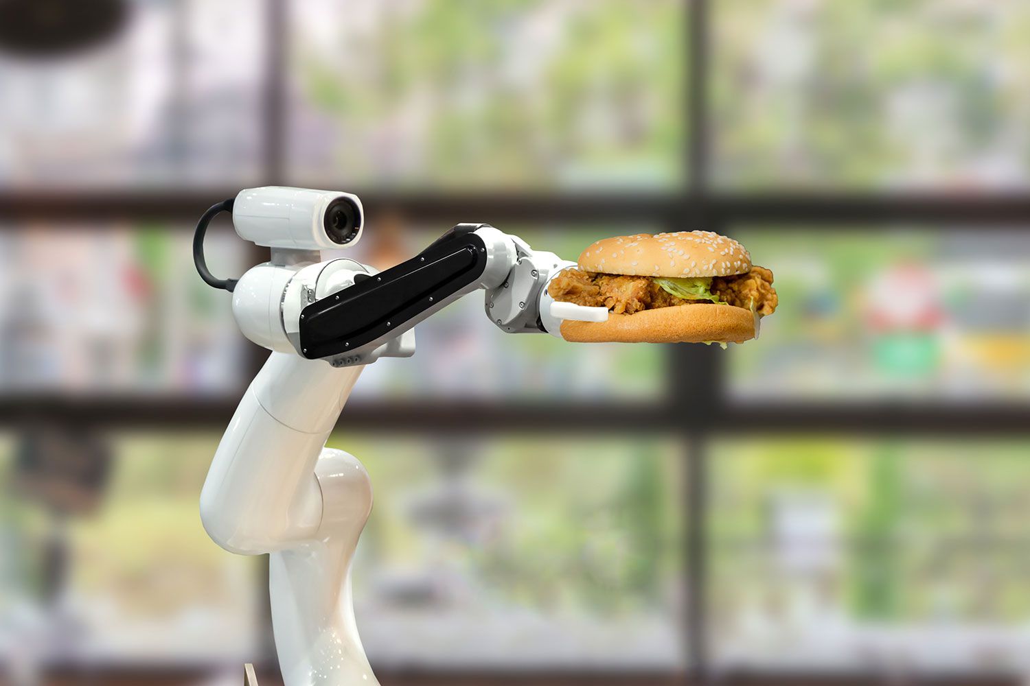 Robot holding sandwich
