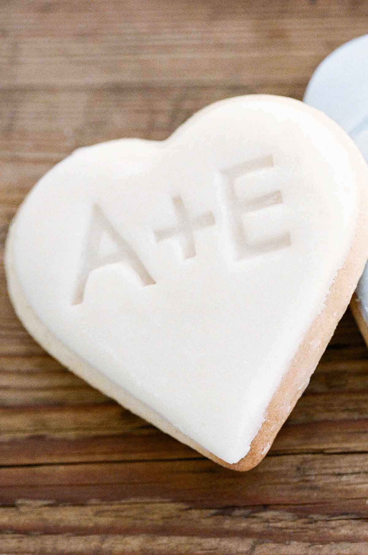 initials white frosted heart shaped cookies
