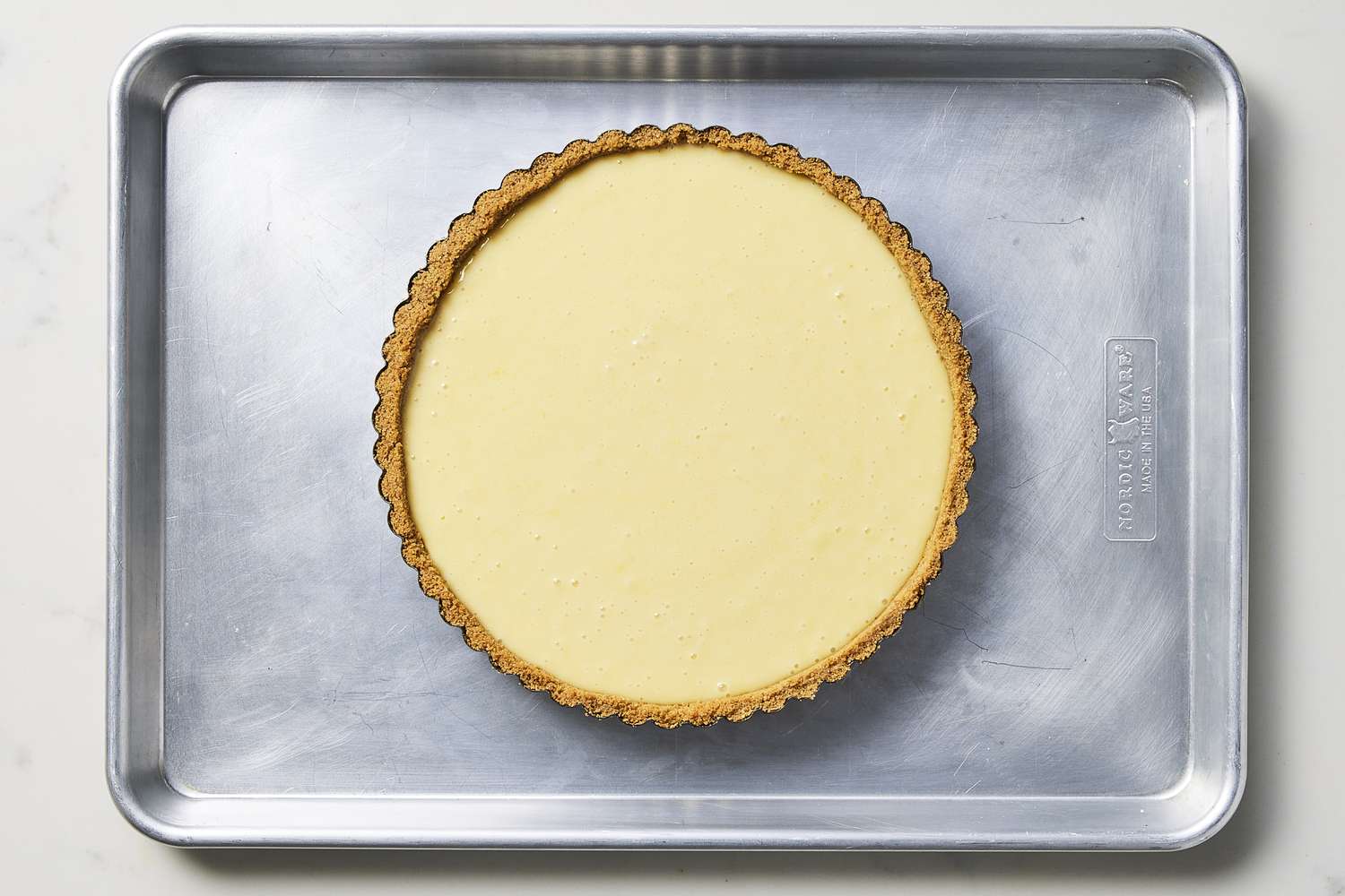Key lime tart on baking sheet