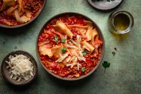 lasagna soup topped with cheese in a bowl