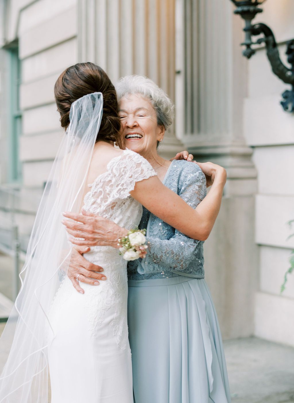 bride hugging grandma outside