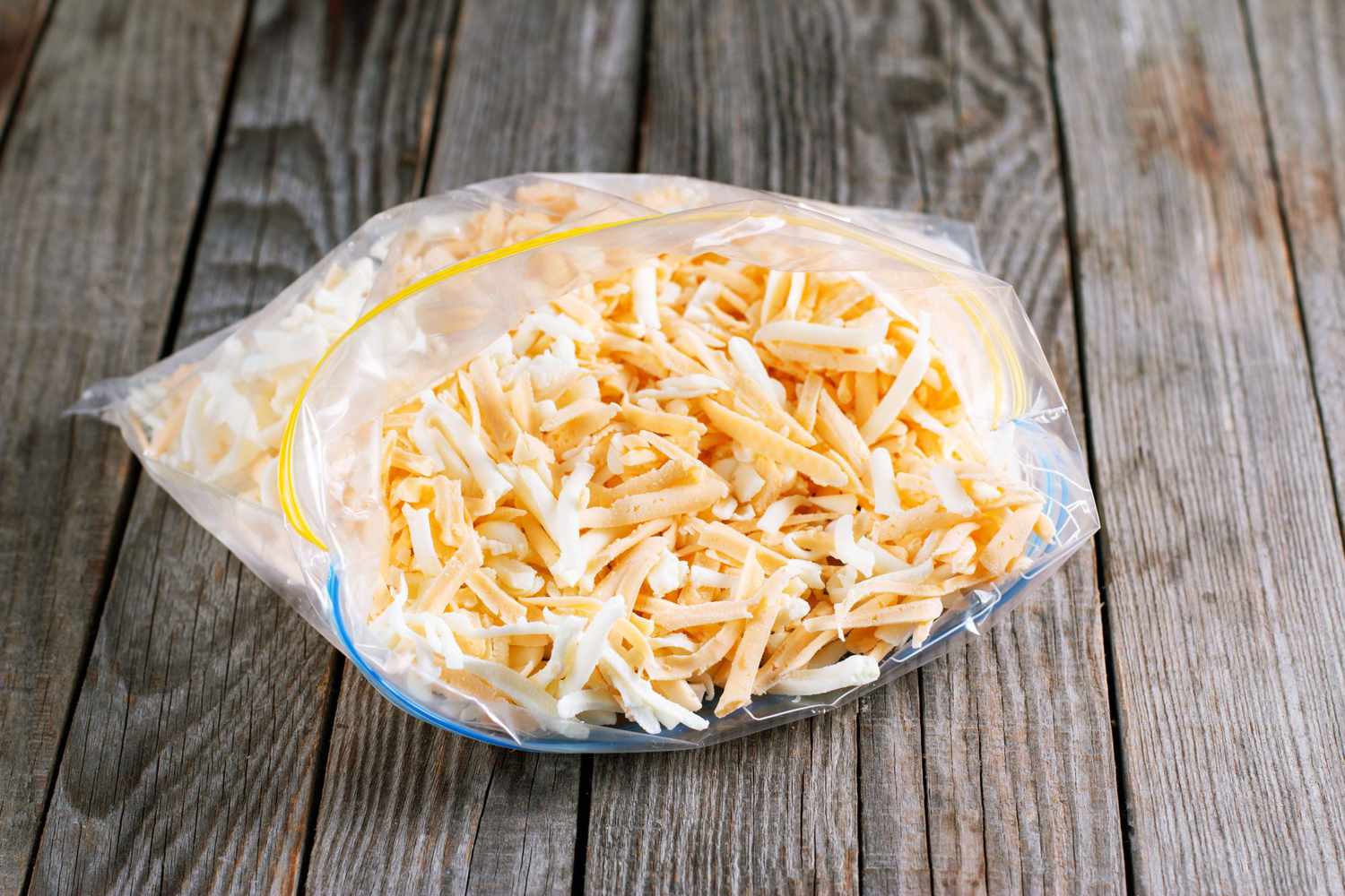 frozen grated cheese in plastic bag