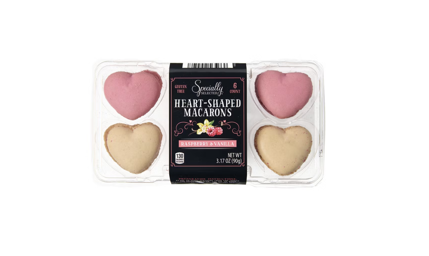 Heartshaped macarons in a plastic package two pink and two beige labeled raspberry and vanilla flavors