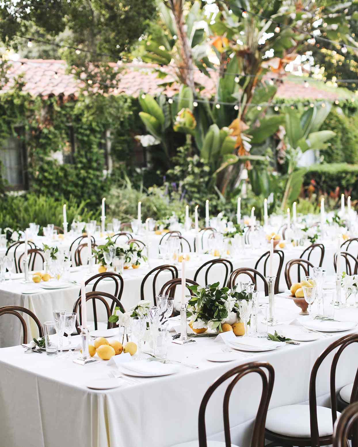 pia davide white wedding reception tables with lemon centerpieces