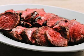 peppercorn crusted beef tenderloin slices on plate