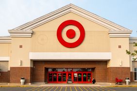 The exterior of a Target store entrance with a red Target logo above the doors