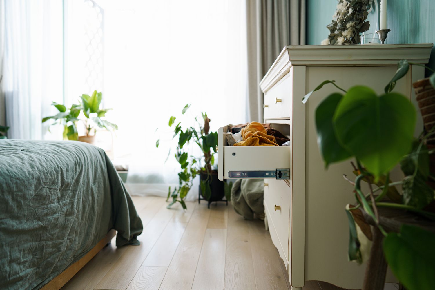 opened dresser drawer in bedroom