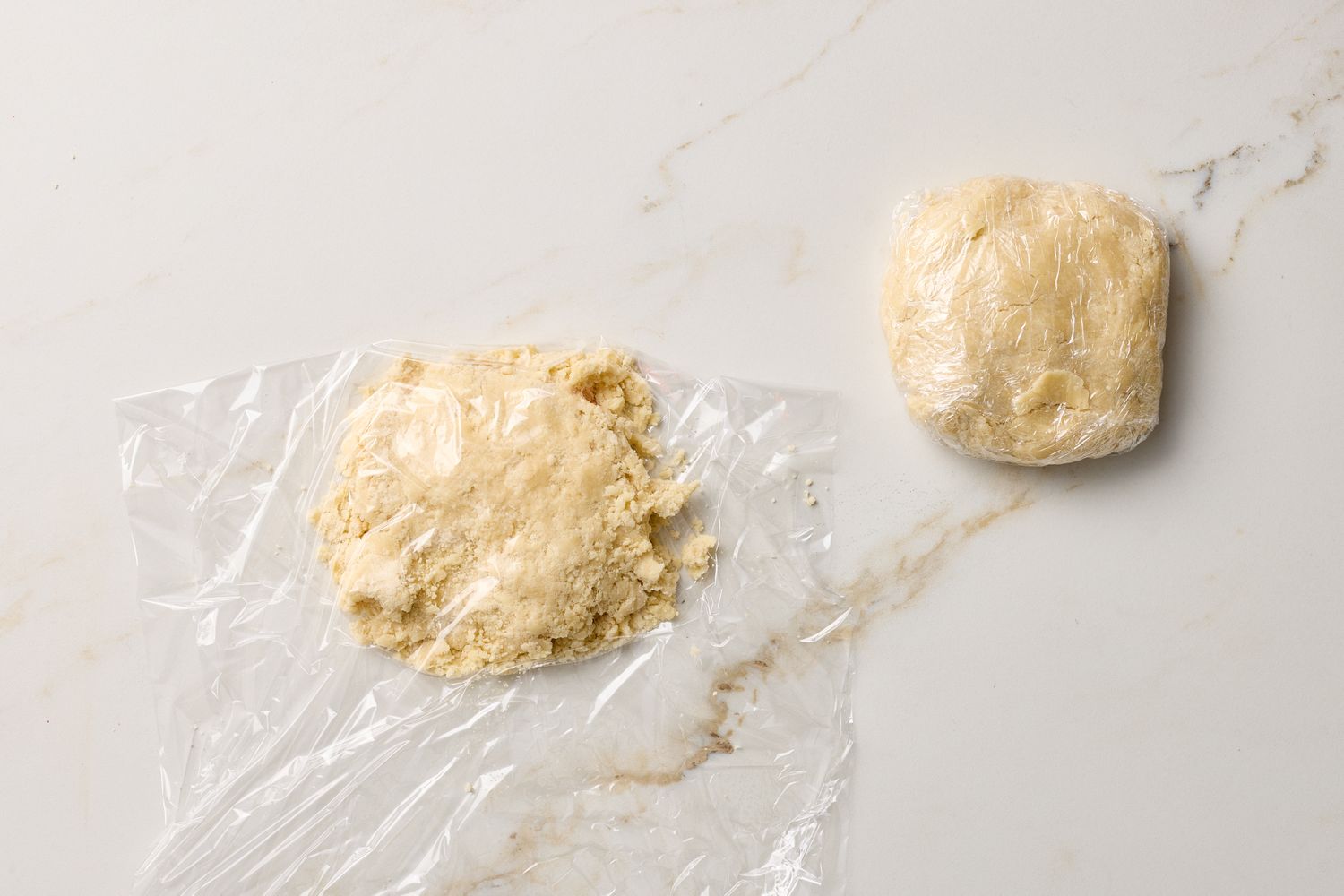 Shortbread dough one wrapped and one partially wrapped in plastic wrap