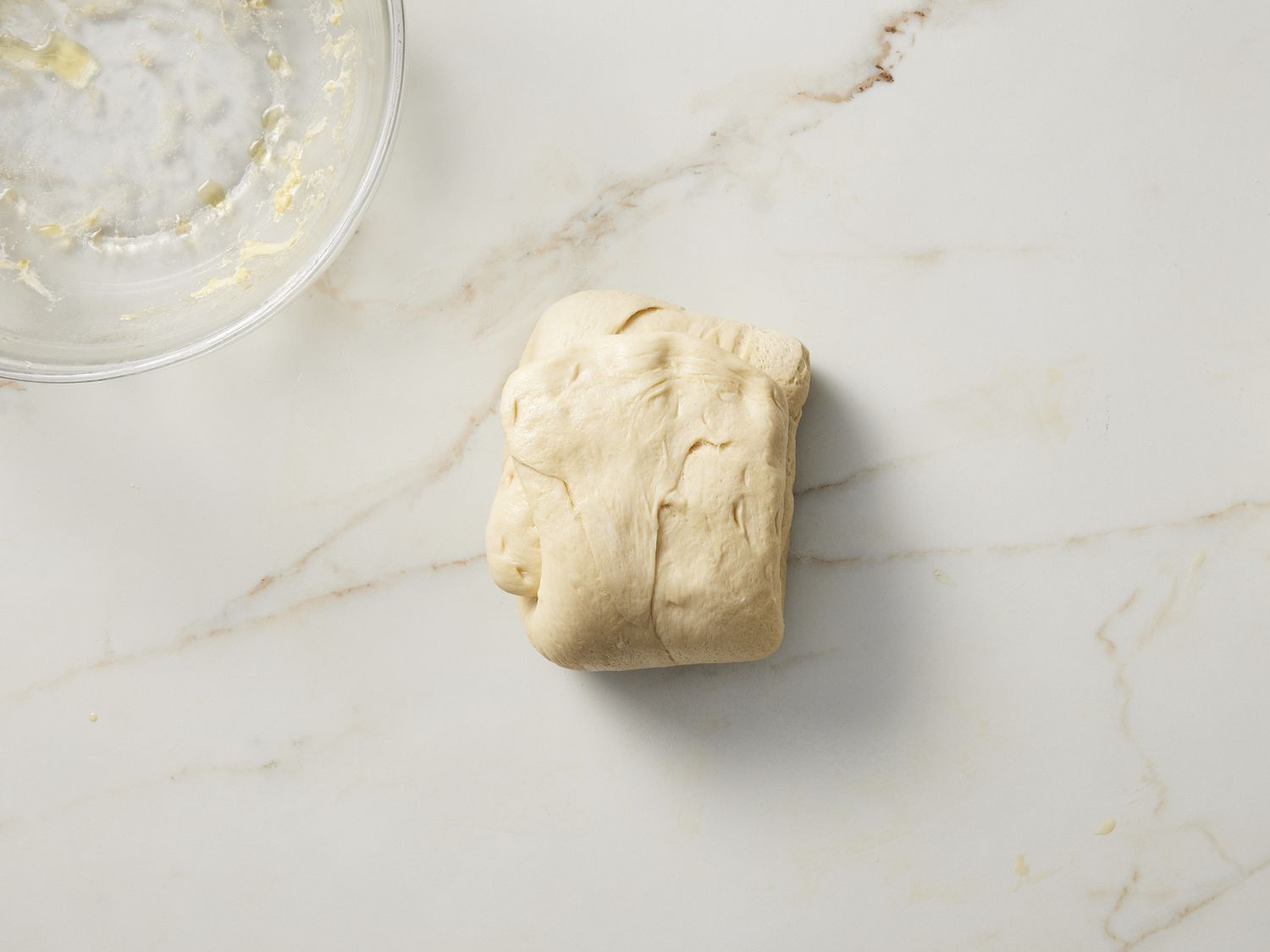 Folded dough on marble