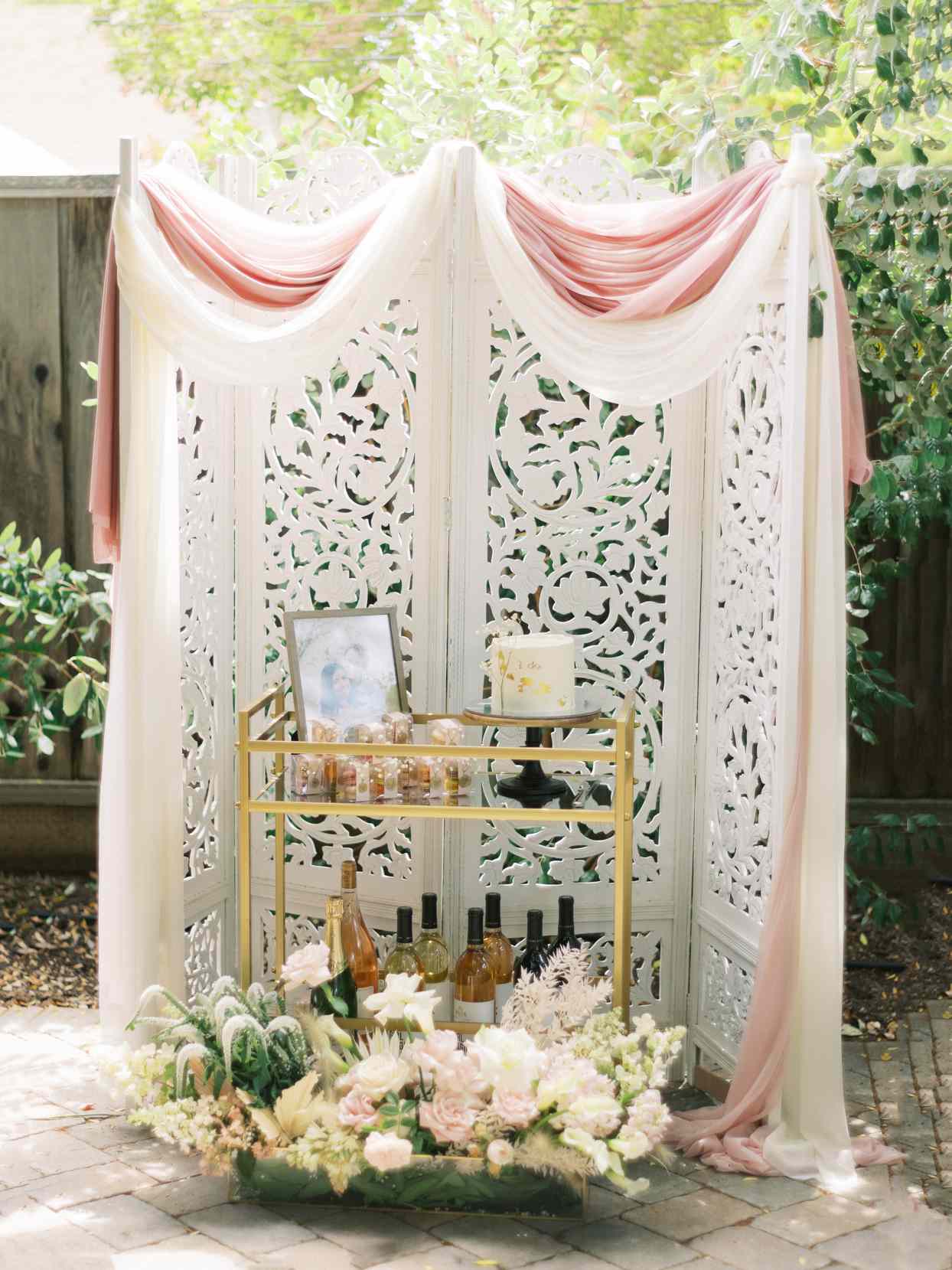 wedding cake stand with pink and cream florals