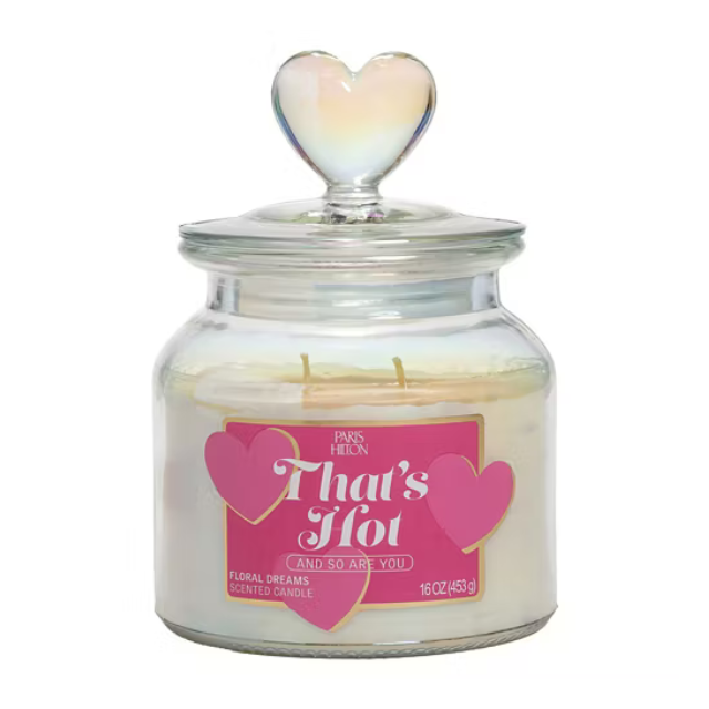 A jar candle labeled Thats Hot with decorative heart designs and a heartshaped lid