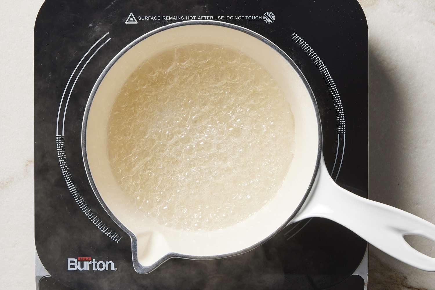 Boiling water and sugar