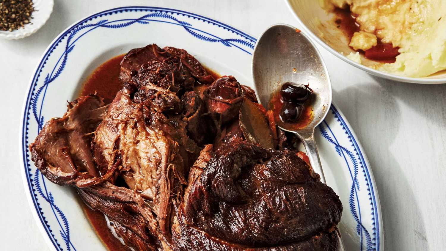 pressure cooker pot roast with dates olives and orange blue white serving tray