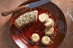 nut and seed banana bites served on a red plate
