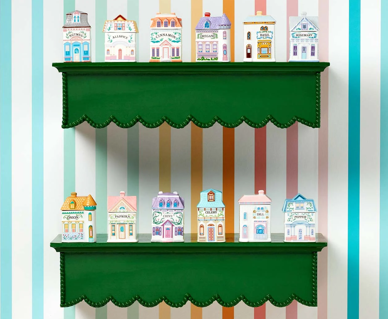 Decorative spice containers shaped like miniature storefronts on green shelves against a striped background