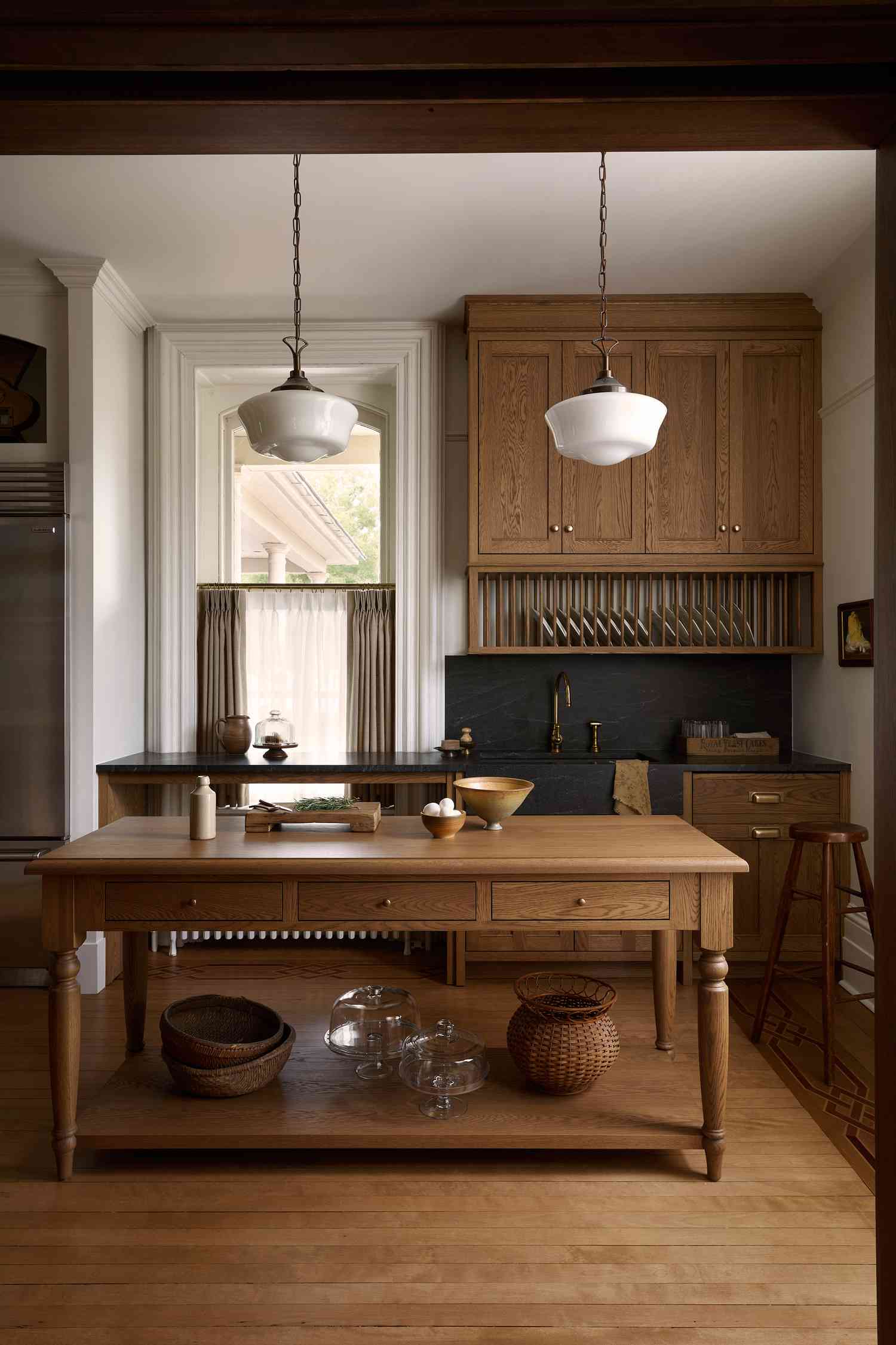 wood kitchen with brass pulls