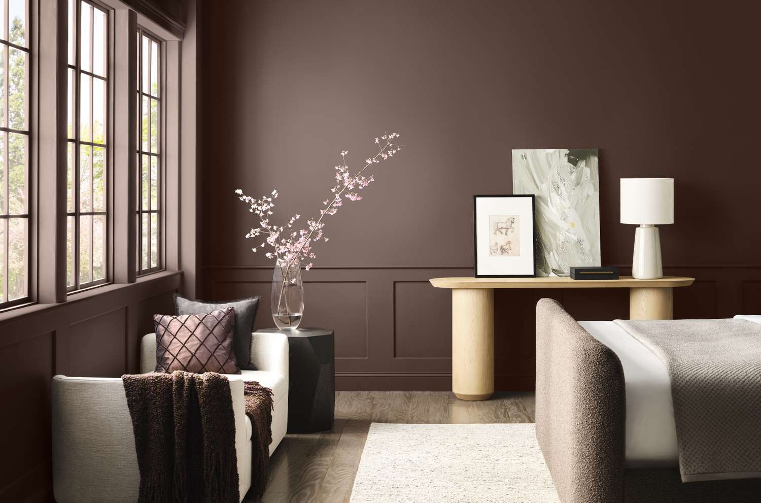 Elegant interior space featuring a bedroom with modern furnishings and artwork on a console table