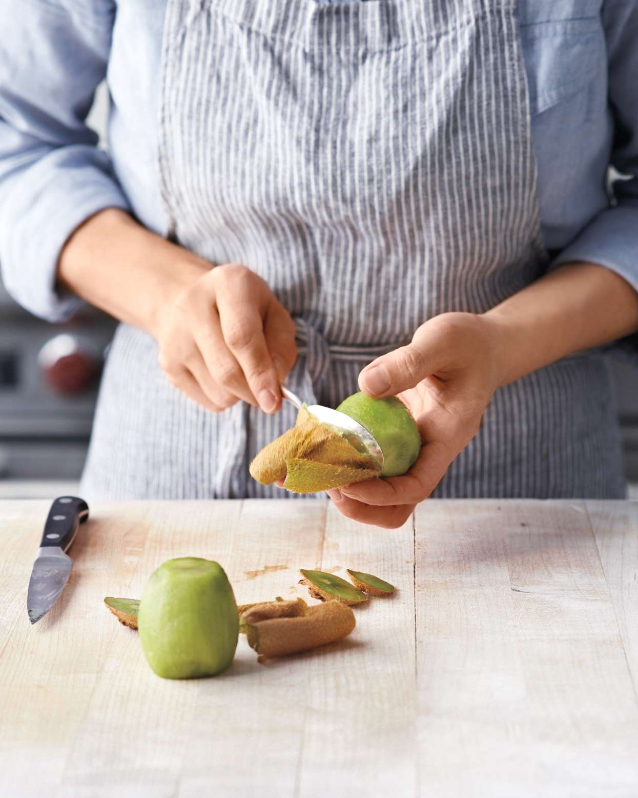 peeling and slicing a kiwi 