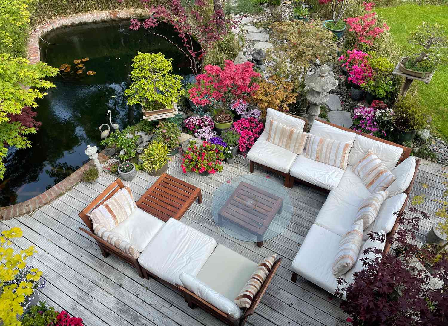 deck with seating near a koi pond
