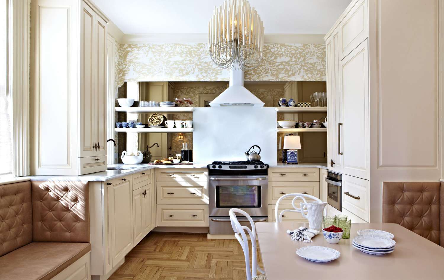 small kitchen with neutral color wallpaper and hanging light fixture