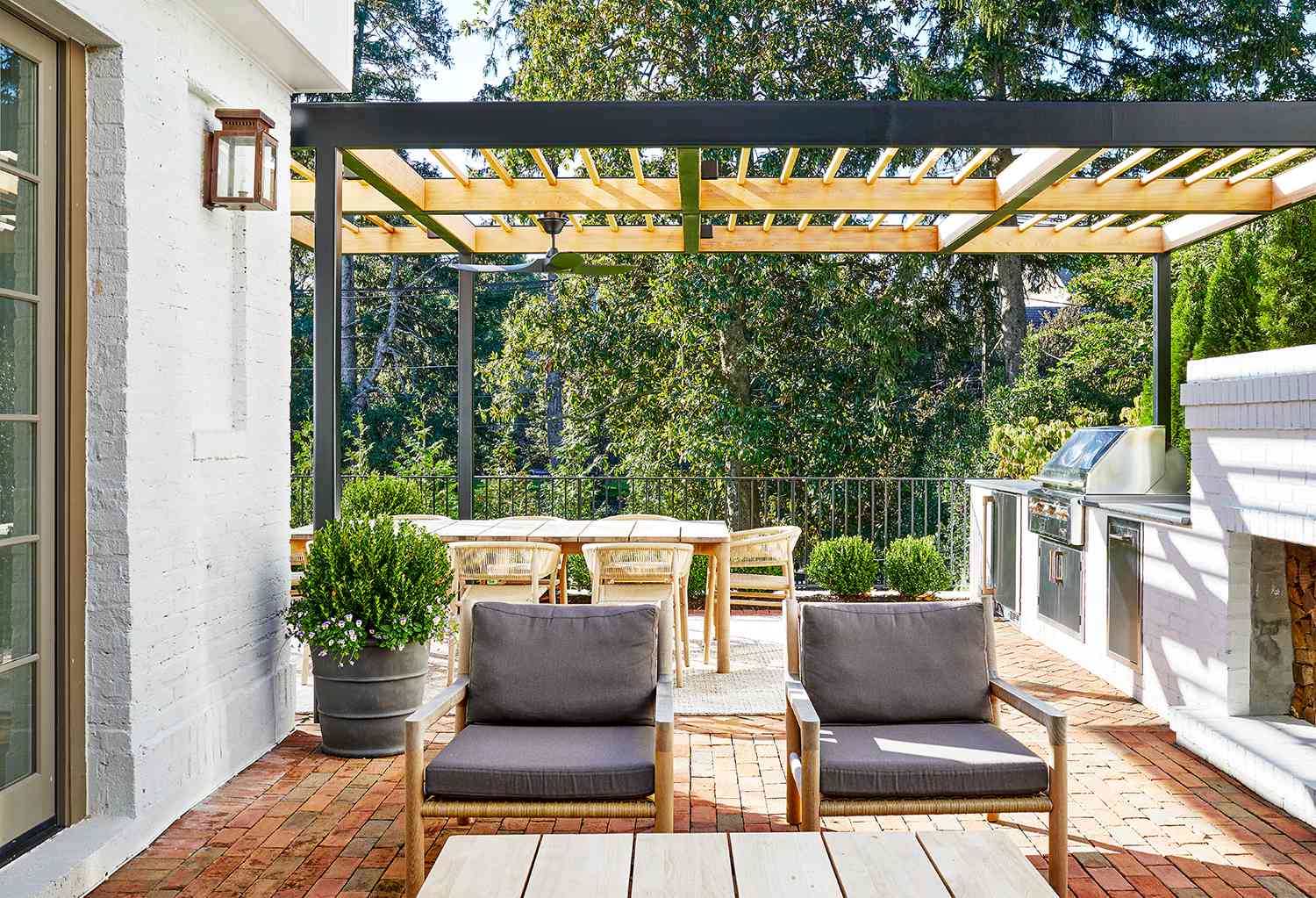 an outdoor patio covered by a wooden trellis