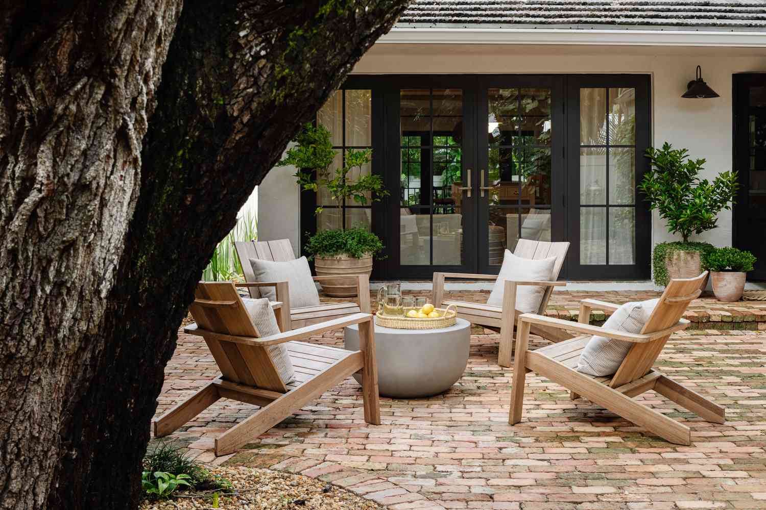 Teak furniture around a fireplace