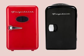 Two compact Frigidaire brand retrostyle refrigerators side by side