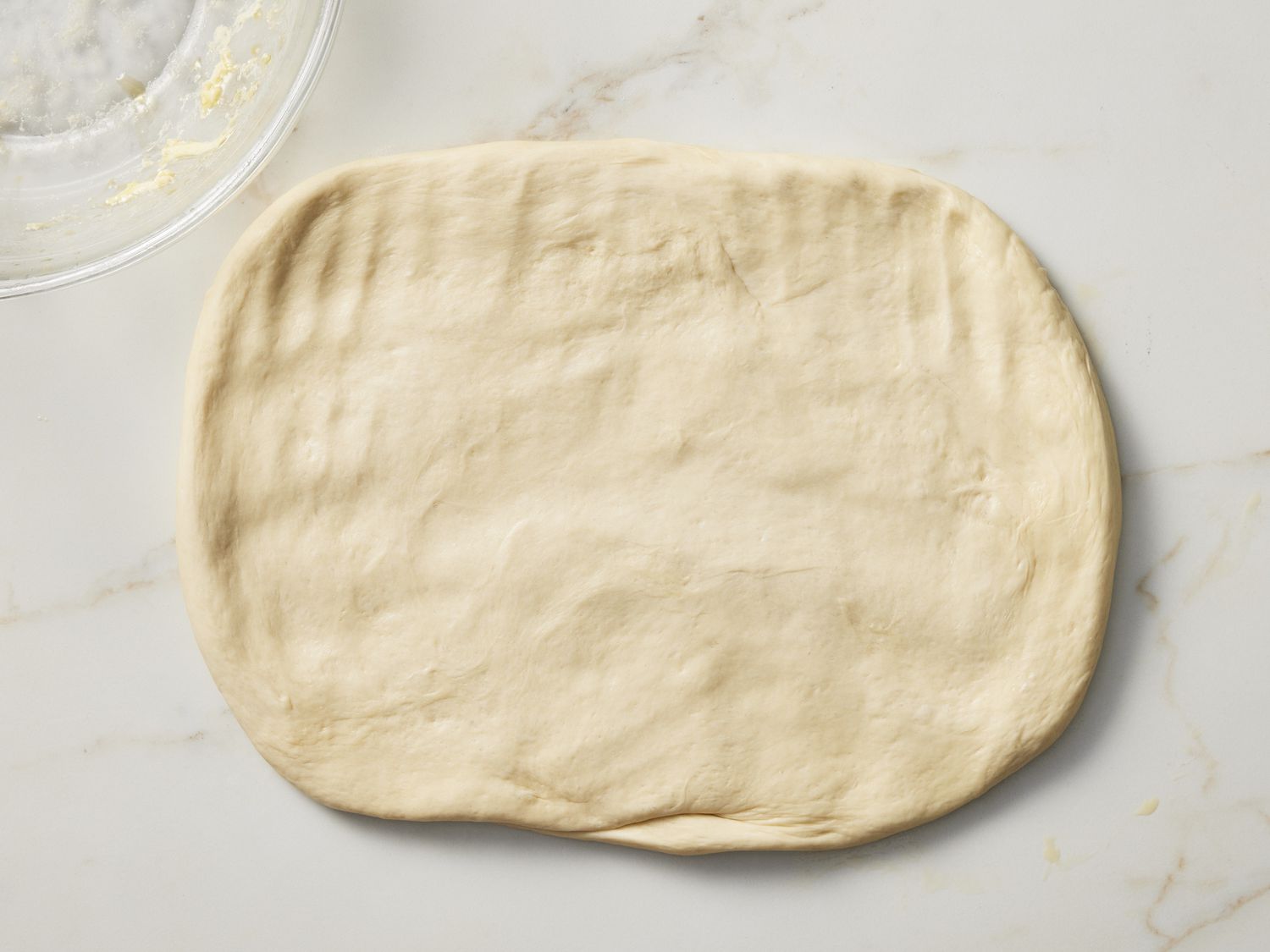 Rolled out dough on marble