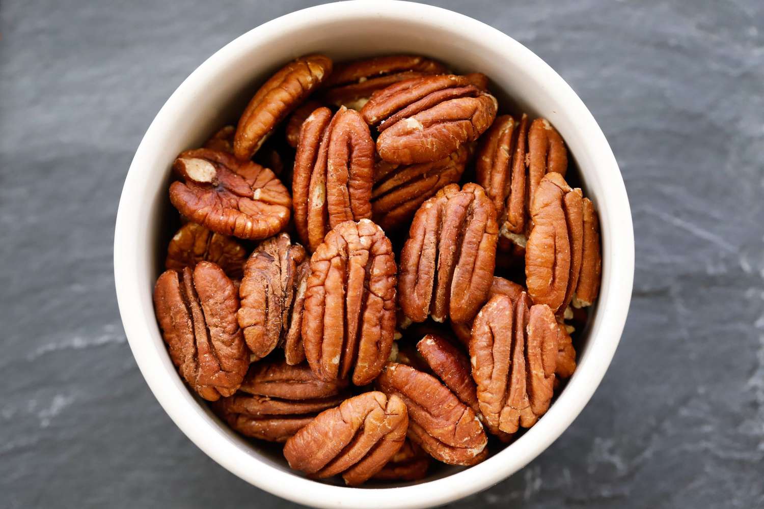 whole pecans in a bowl